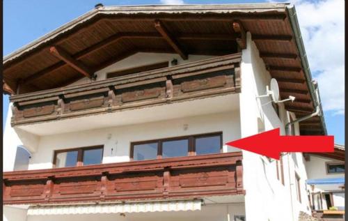 a building with a red arrow pointing at a building at Cosy apartment Bad Ischl in quiet residential area - newly renovated in Bad Ischl