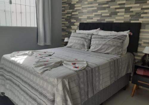 Un pat sau paturi într-o cameră la Casa Serena Jacumã