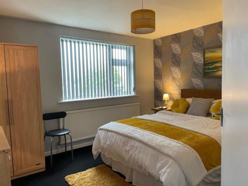 a bedroom with a bed and a window at Hoffman Hideaway in Buxton