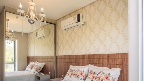 Ένα ή περισσότερα κρεβάτια σε δωμάτιο στο Recanto da Gracieli