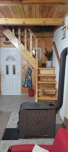 a living room with a stair case and a door at Vikendica Raković in Zlatibor