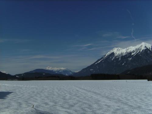 a snow covered mountain range in the distance at Ferienwohnung Millonigg in Vorderberg