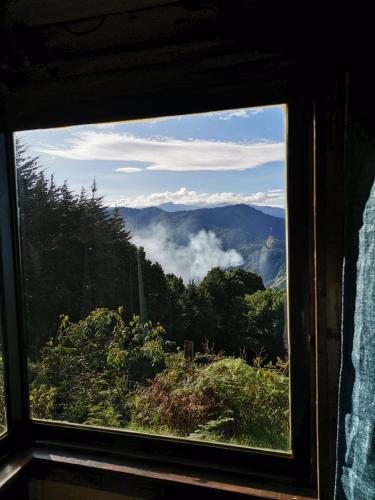 a view of a mountain through a window at Casa de campo Jaulares in Alaska