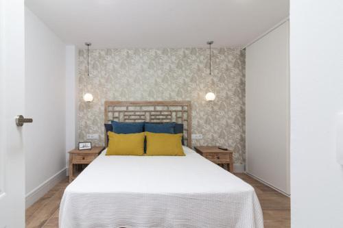 En eller flere senge i et værelse på HomeForGuest Atico Cecilia con vistas al mar en Los Cristianos