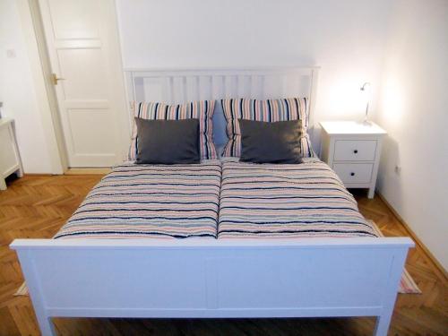 Posteľ alebo postele v izbe v ubytovaní PANORAMA apartmán ajaj