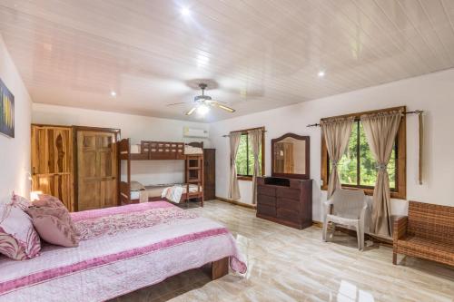 a bedroom with a large bed and a dresser in it at Casa Danta in Drake