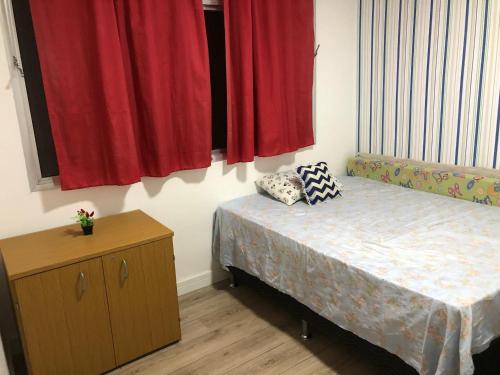 Voodi või voodid majutusasutuse Excelente apartamento na Praia Grande, todo mobiliado, móveis todos novos , não tem como não gostar toas