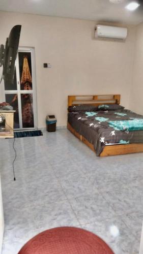 Ένα ή περισσότερα κρεβάτια σε δωμάτιο στο Villa D Kebun