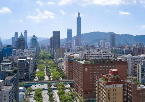 a view of a city with tall buildings and trees at The Howard Plaza Hotel Taipei in Taipei