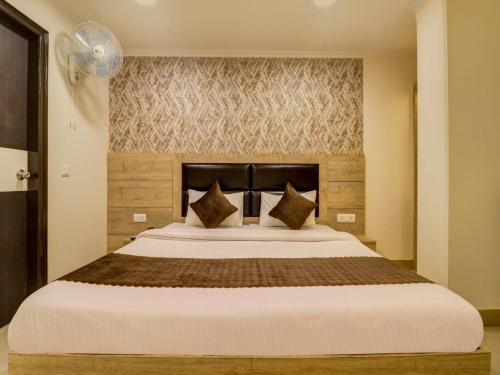 
a hotel room with a bed and two lamps at Hotel Dakha International Karol Bagh Newly Modified in New Delhi
