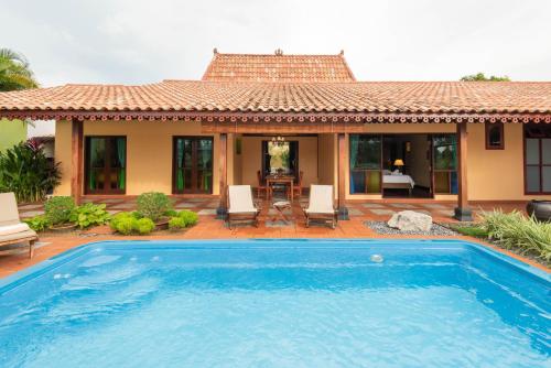 Πισίνα στο ή κοντά στο Limasan Villa Langkawi