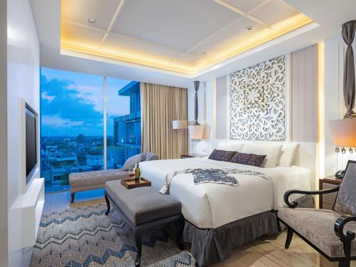 Tempat tidur dalam kamar di ARTOTEL Suites Bianti Yogyakarta, CHSE Certified