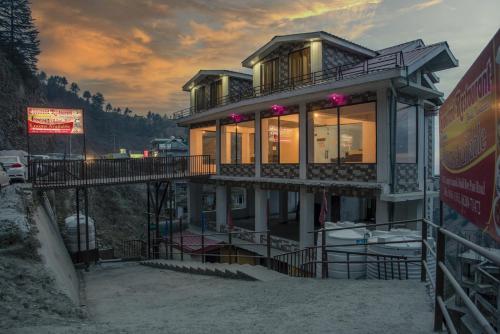 a house on the side of a mountain at Snow Land Shimla in Shimla