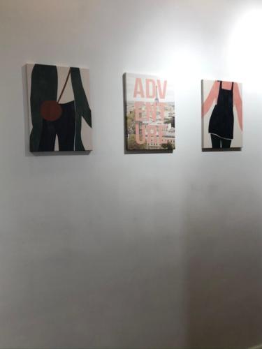 a group of four pictures on a wall at SUCASA RA’ANANA in Ra‘ananna
