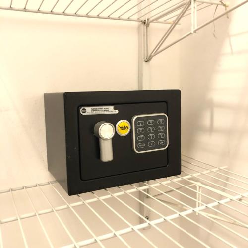 a microwave oven sitting on top of a shelf at SUCASA RA’ANANA in Ra‘ananna