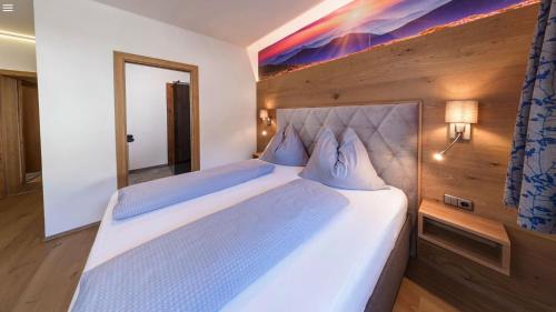Postel nebo postele na pokoji v ubytování Apart Sonja Mayrhofen