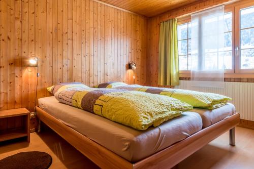 Postel nebo postele na pokoji v ubytování Chalet Sunnegga