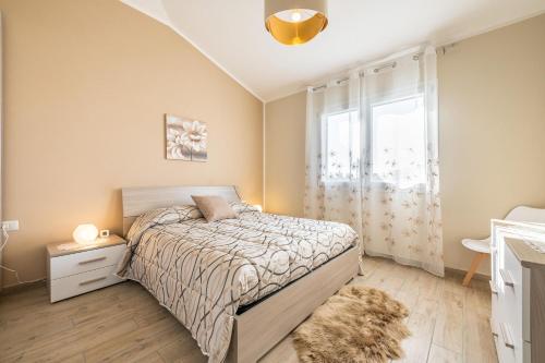 מיטה או מיטות בחדר ב-Villa Patrizia