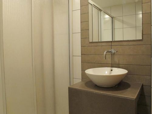a bathroom with a sink and a mirror at Oscar Inn in Petaling Jaya