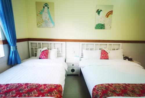 Postel nebo postele na pokoji v ubytování Shenzhen Xichong beach Lanting Homestay