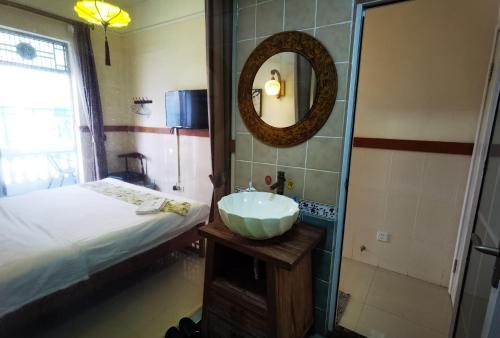 Postel nebo postele na pokoji v ubytování Shenzhen Xichong beach Lanting Homestay