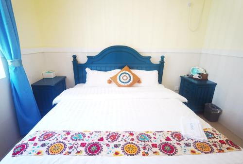 Postel nebo postele na pokoji v ubytování Shenzhen Xichong beach Lanting Homestay