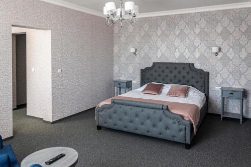 Кровать или кровати в номере Бутик-отель Замок