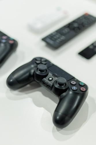 a black video game controller sitting on top of a table at Villa Dispet, sea view, pool, jacuzzi, sauna, cinema in Omiš