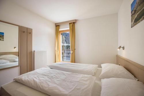 Postel nebo postele na pokoji v ubytování Runcac Apt Corn