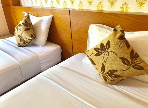 Postel nebo postele na pokoji v ubytování Andaman Resort