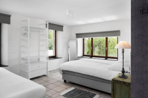 Postel nebo postele na pokoji v ubytování Hotel Aux Ecuries De La Reine