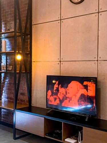 a flat screen tv sitting on top of a table at Maison life 小居屋 The Loft Imago in Kota Kinabalu