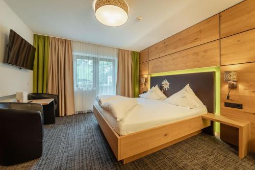 Posteľ alebo postele v izbe v ubytovaní Kräuterhotel Hochzillertal