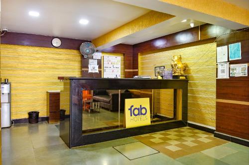 a lobby with a job sign in a room at FabHotel Ocean View Apartment, Dabolim in Old Goa
