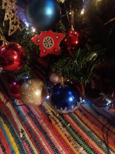 a close up of a christmas tree with ornaments at Cycladic House in Vari