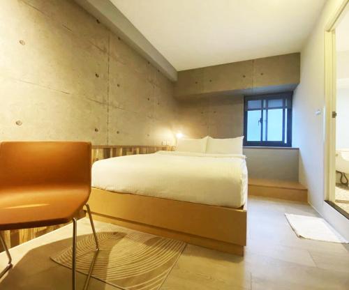 Postel nebo postele na pokoji v ubytování M Taipei Hotel