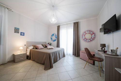 A bed or beds in a room at Agriturismo Tenuta Don Carlo