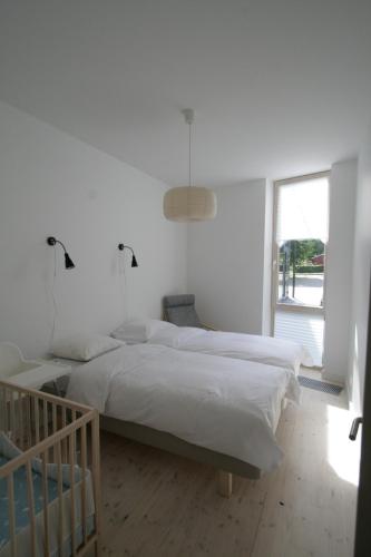 Postel nebo postele na pokoji v ubytování Miško Apartamentai