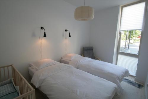 Postel nebo postele na pokoji v ubytování Miško Apartamentai