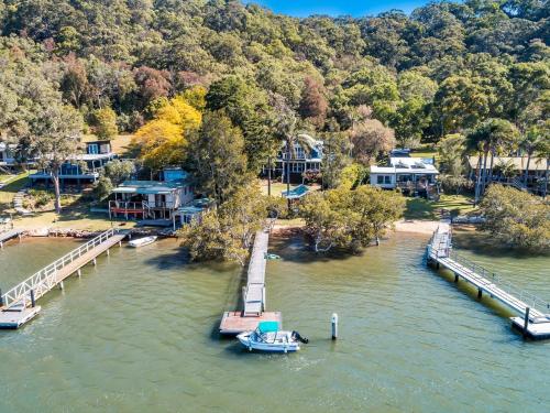 a boat is docked at a dock in the water at Your Perfect Waterfront Escape in Bar Point