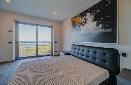 Posteľ alebo postele v izbe v ubytovaní Villa Liam con Piscina - Goelba