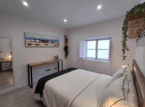 A bed or beds in a room at Apartamento en Alicante La Casa Azul