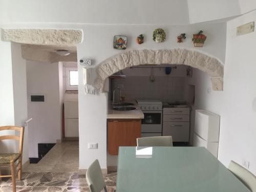 Kuchyň nebo kuchyňský kout v ubytování Casa Merlata