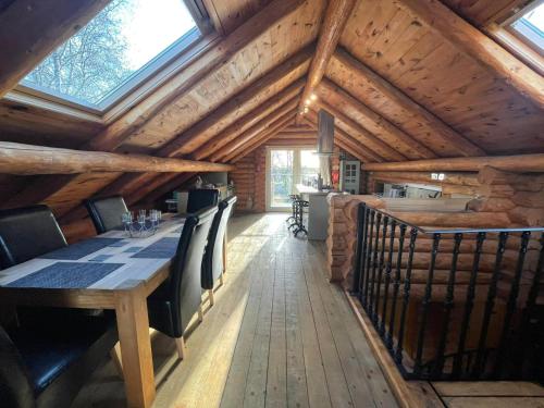 Gallery image of Woodpecker Log Cabin with hot tub, pizza oven bbq entertainment area, lakeside with private fishing peg situated at Tattershall Lakes in Tattershall