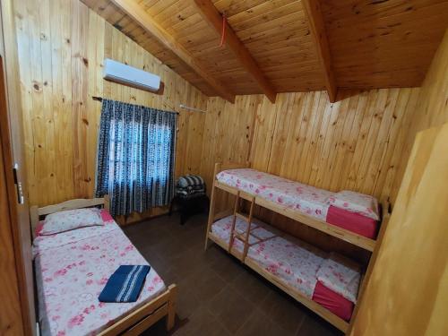 A bed or beds in a room at Morada Silvestre Iguazú