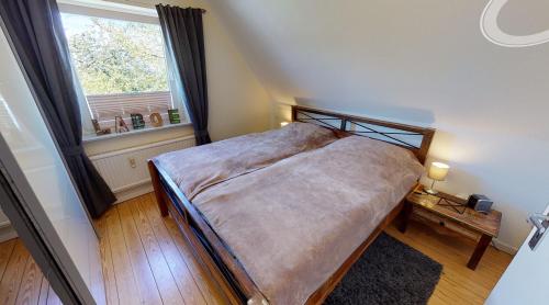Ένα ή περισσότερα κρεβάτια σε δωμάτιο στο Ferienwohnung Nordlicht Laboe