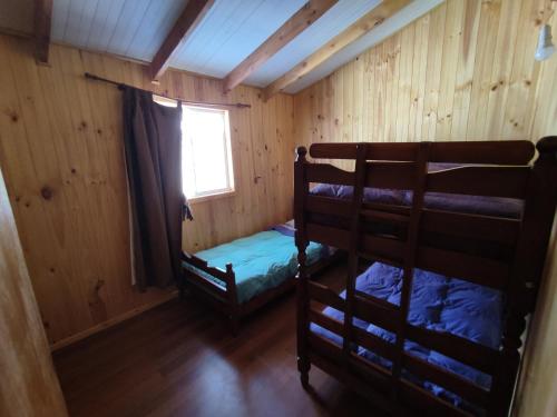 Cama o camas de una habitación en Cabañas Kalinaw