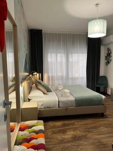 a bedroom with a bed and a window at Le Sciantose Relais in Naples