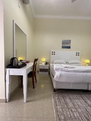 Postel nebo postele na pokoji v ubytování Ibra Plaza Hotel