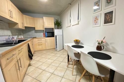 a kitchen with a white counter and white appliances at ☆ L'évasion En Provence ☆ Clim-Wifi-Netflix ☆ in Carnoux